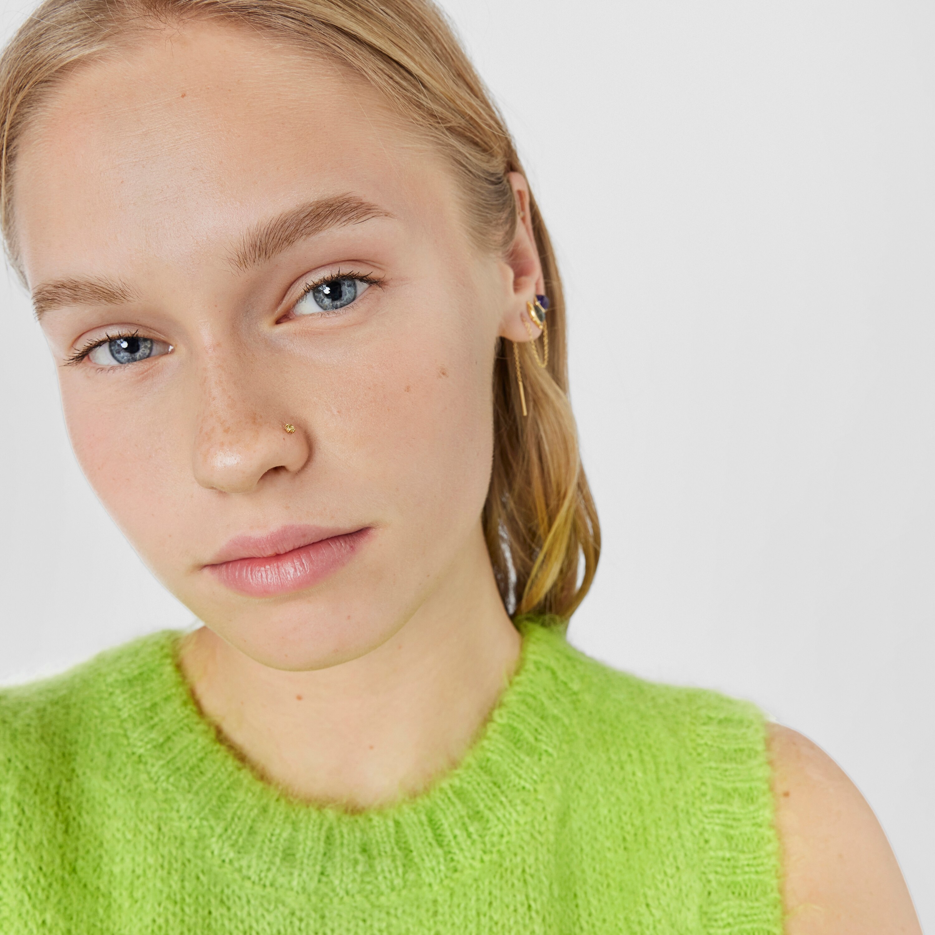 Gold-colored IP steel and garnet and peridot Beach Nose piercing
