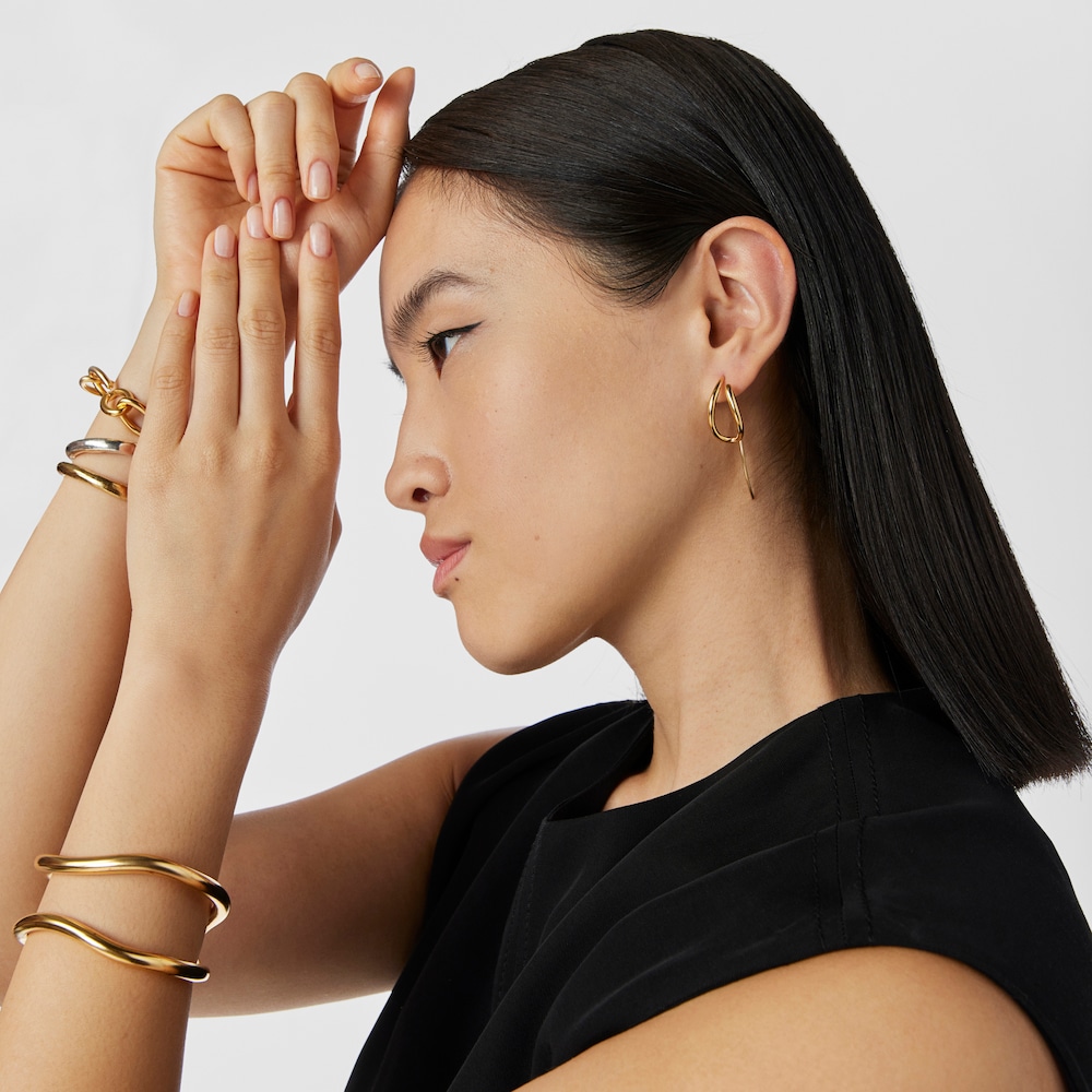 Aretes con ba&ntilde;o de oro 18 kt sobre plata Bent