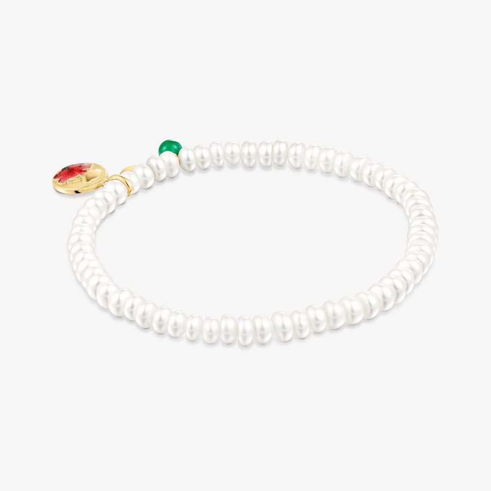 Pulsera el&aacute;stica de perlas cultivadas y motivo con ba&ntilde;o de oro 18 kt sobre plata y oso y flor Maga