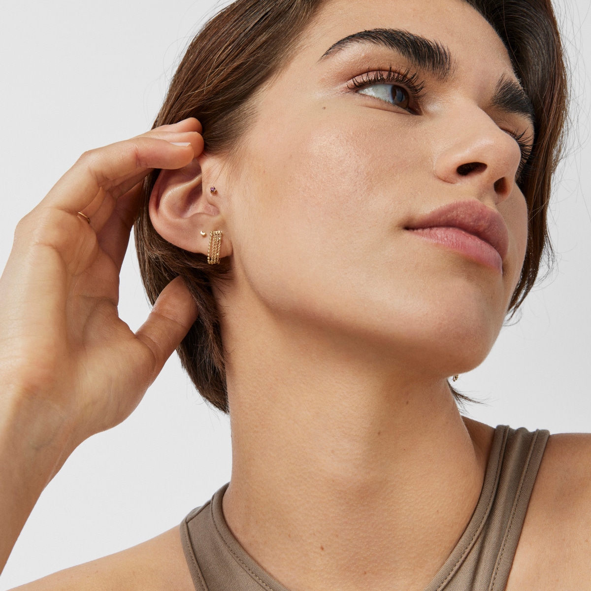 Gold TOUS Cool Joy Ear piercing with rhodolite