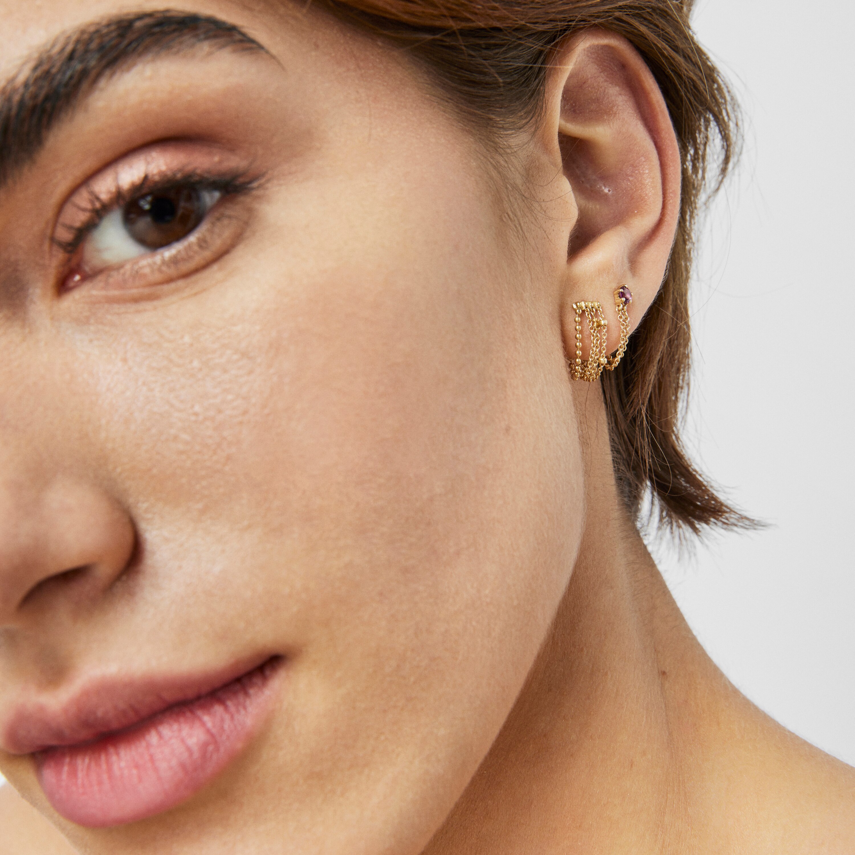 Gold TOUS Cool Joy 1/2 Earring with double chain and rhodolite