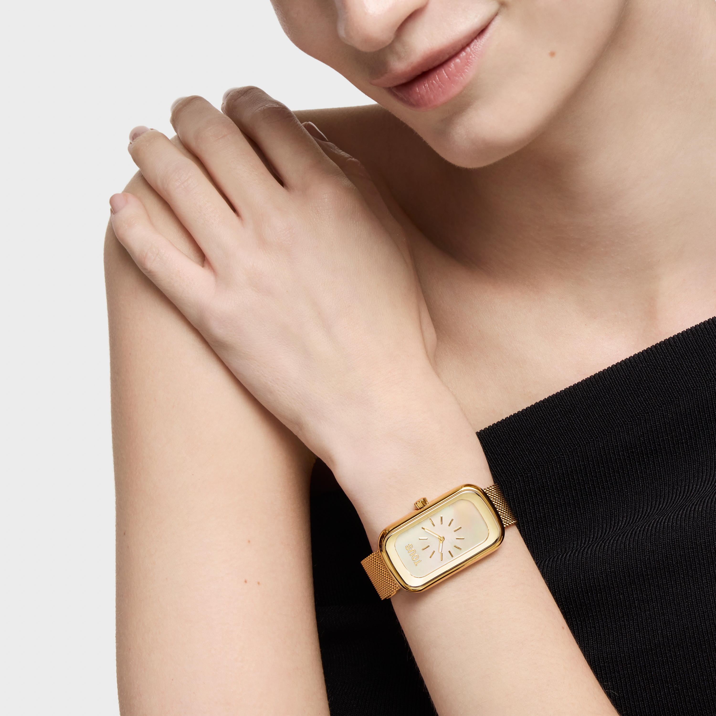 Analog watch with mother-of-pearl face and gold-colored steel