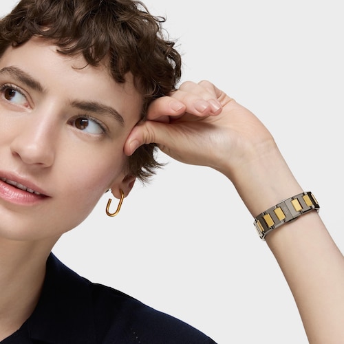 Reloj analógico con brazalete de acero negro, dorado y esfera de nácar gris Karat