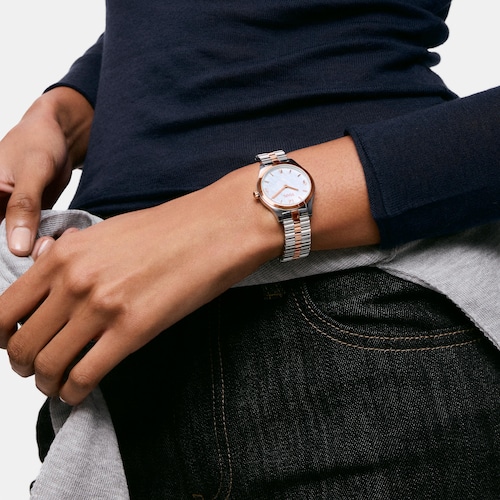 Anal&oacute;gov&eacute; hodinky s&nbsp;n&aacute;ramkom z&nbsp;ocele a&nbsp;ocele ružovej farby, a&nbsp;perleťov&yacute;m cifern&iacute;kom TOUS EPIC ICON