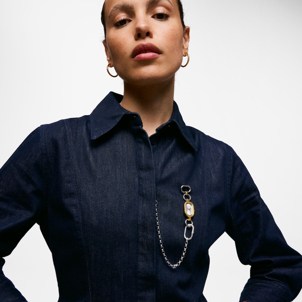 Fermall/rellotge anal&ograve;gic d&rsquo;acer i acer de color daurat TOUS HOLD OVAL