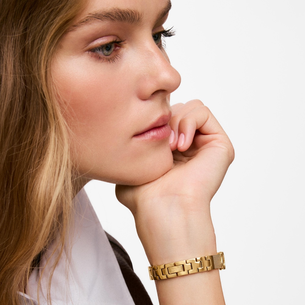 Reloj anal&oacute;gico de acero dorado con n&aacute;car Icon Charms