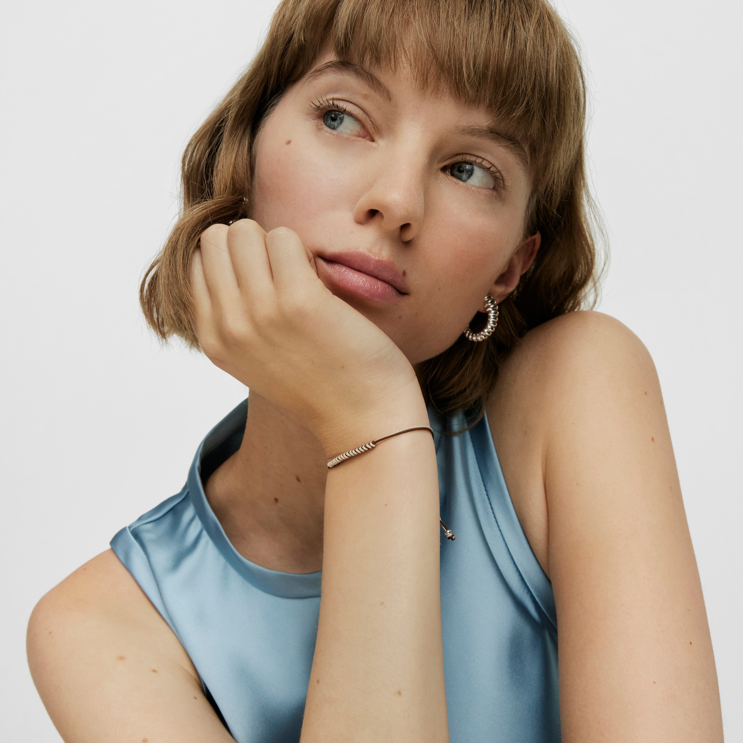 Bold Bear Bracelet with brown and beige cord and a silver bear