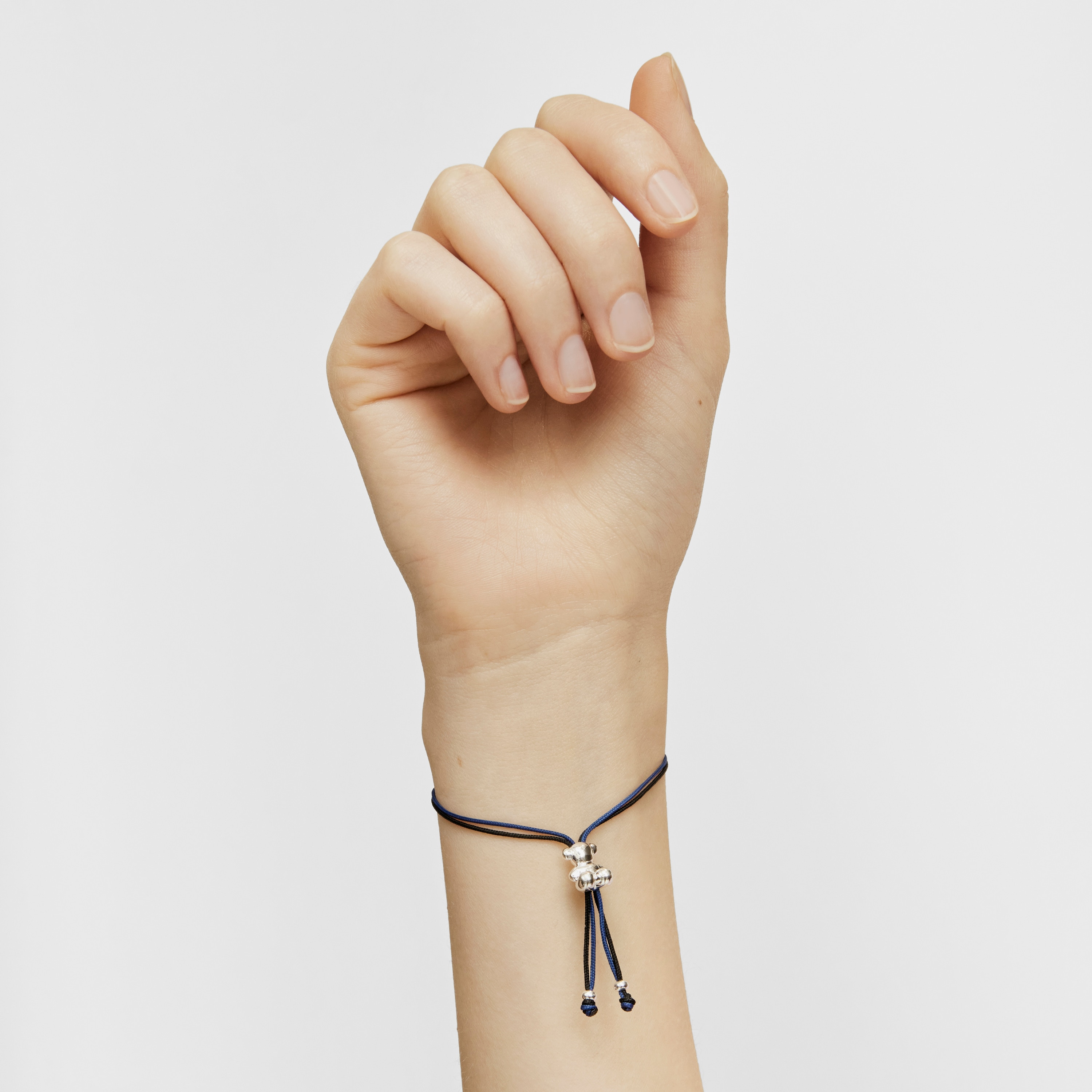 Bold Bear Bracelet with black and navy blue cord and a silver bear