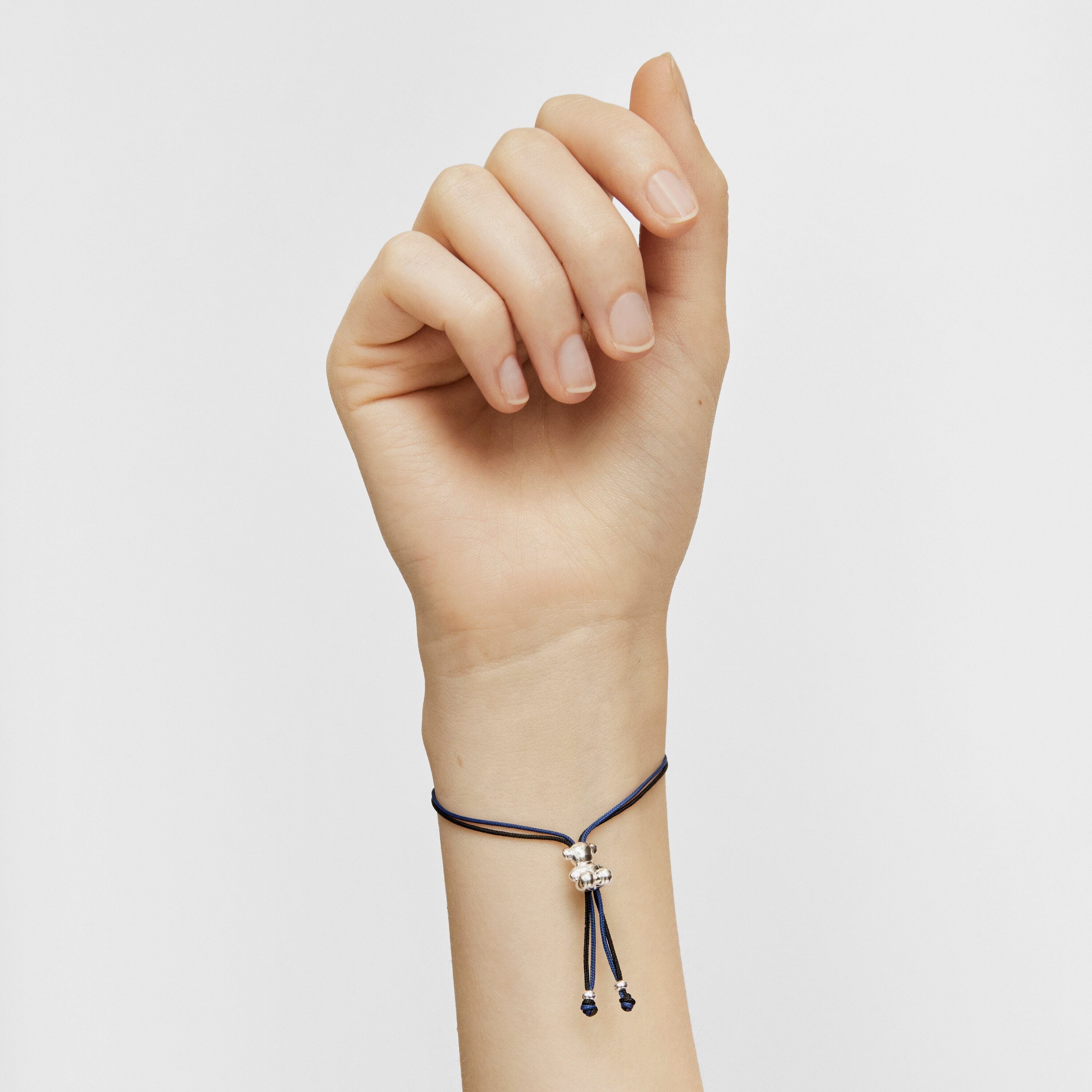 Bold Bear Bracelet with black and navy blue cord and a silver bear