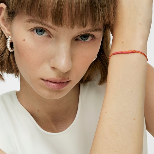 Bold Bear Bracelet with fuchsia and orange cord and a silver bear