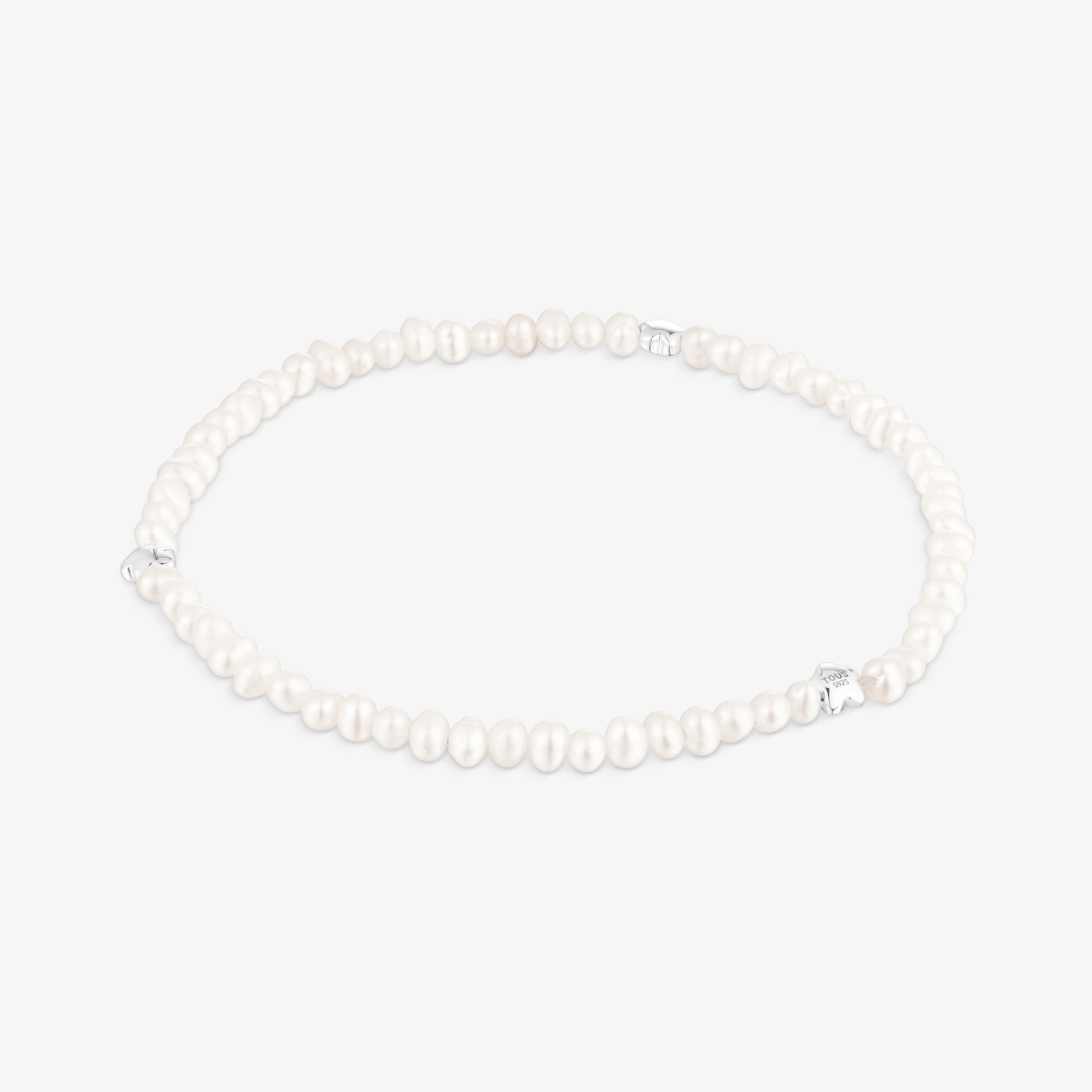 Elastic Bold Motif Bracelet with cultured pearls and flower motifs in silver