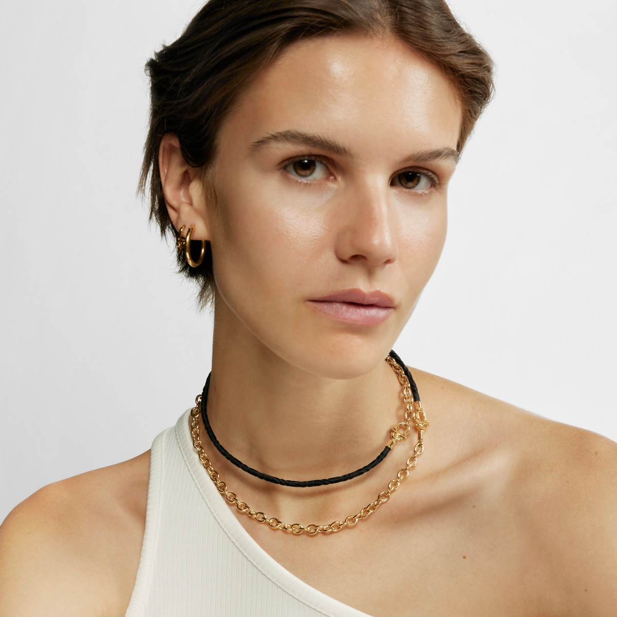 TOUS MANIFESTO Elastic necklace-bracelet with 18 kt gold plating over silver and black cord
