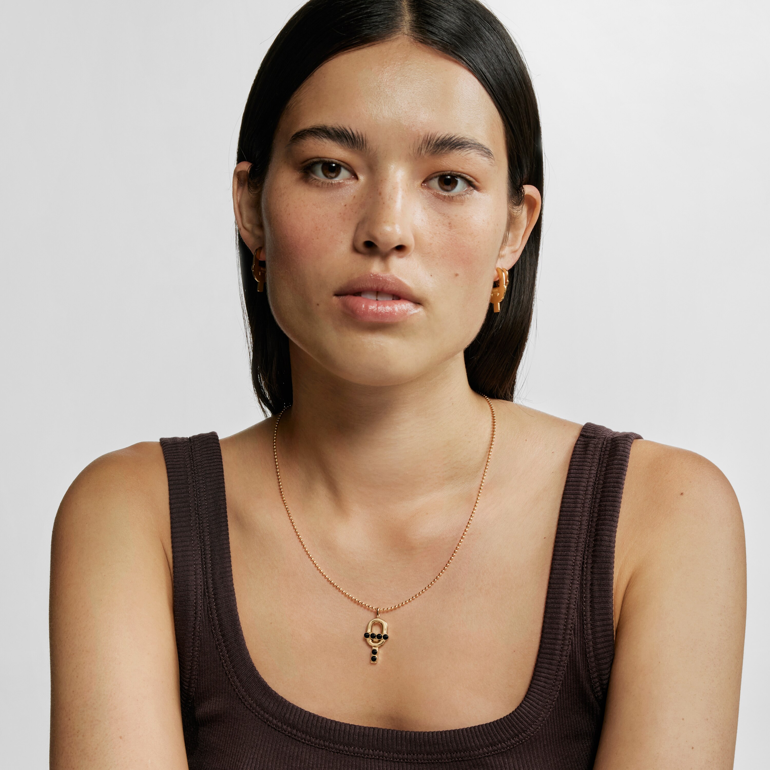 Pendant with 18kt gold plating over silver and onyx TOUS MANIFESTO