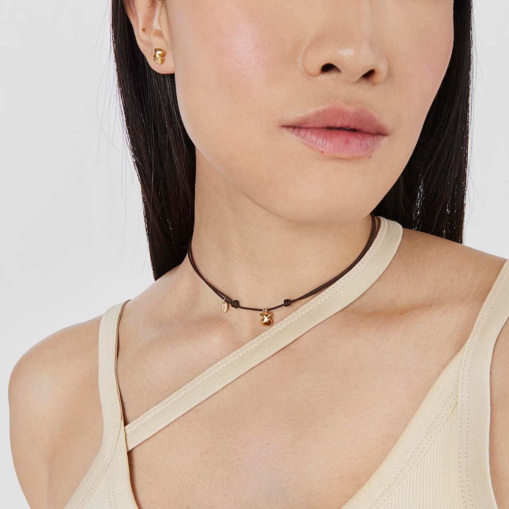 Naszyjnik ze złota z brązowym sznurkiem i motywem misia TOUS Balloon