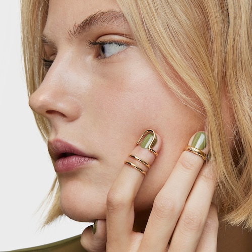 Ring set with 18kt gold plating over silver, double claw and logo Claws