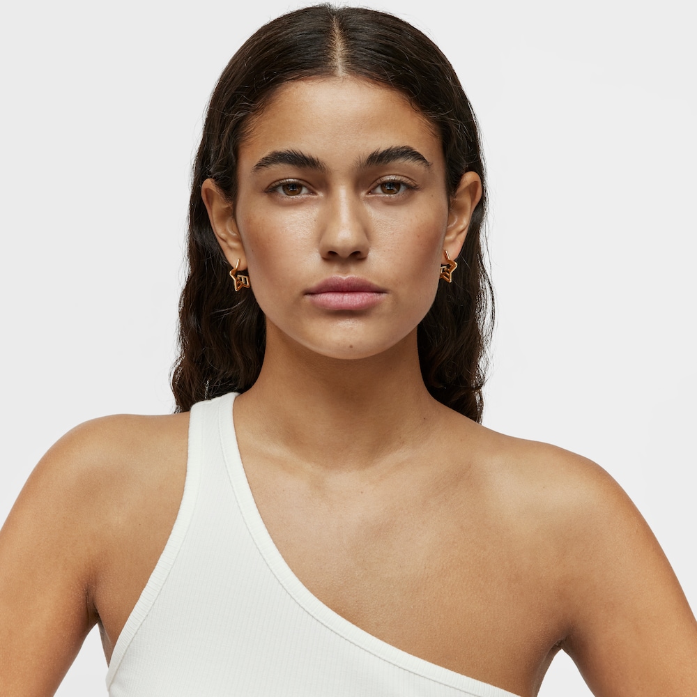 Pendientes peque&ntilde;os triple estrella con ba&ntilde;o de oro 18 kt sobre plata Bickie