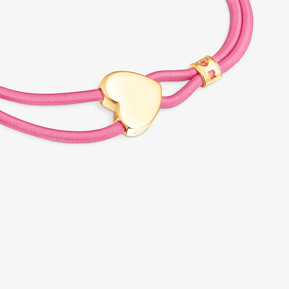 Pulsera el&aacute;stica fucsia y coraz&oacute;n con ba&ntilde;o de oro 18 kt sobre plata Sweet Dolls