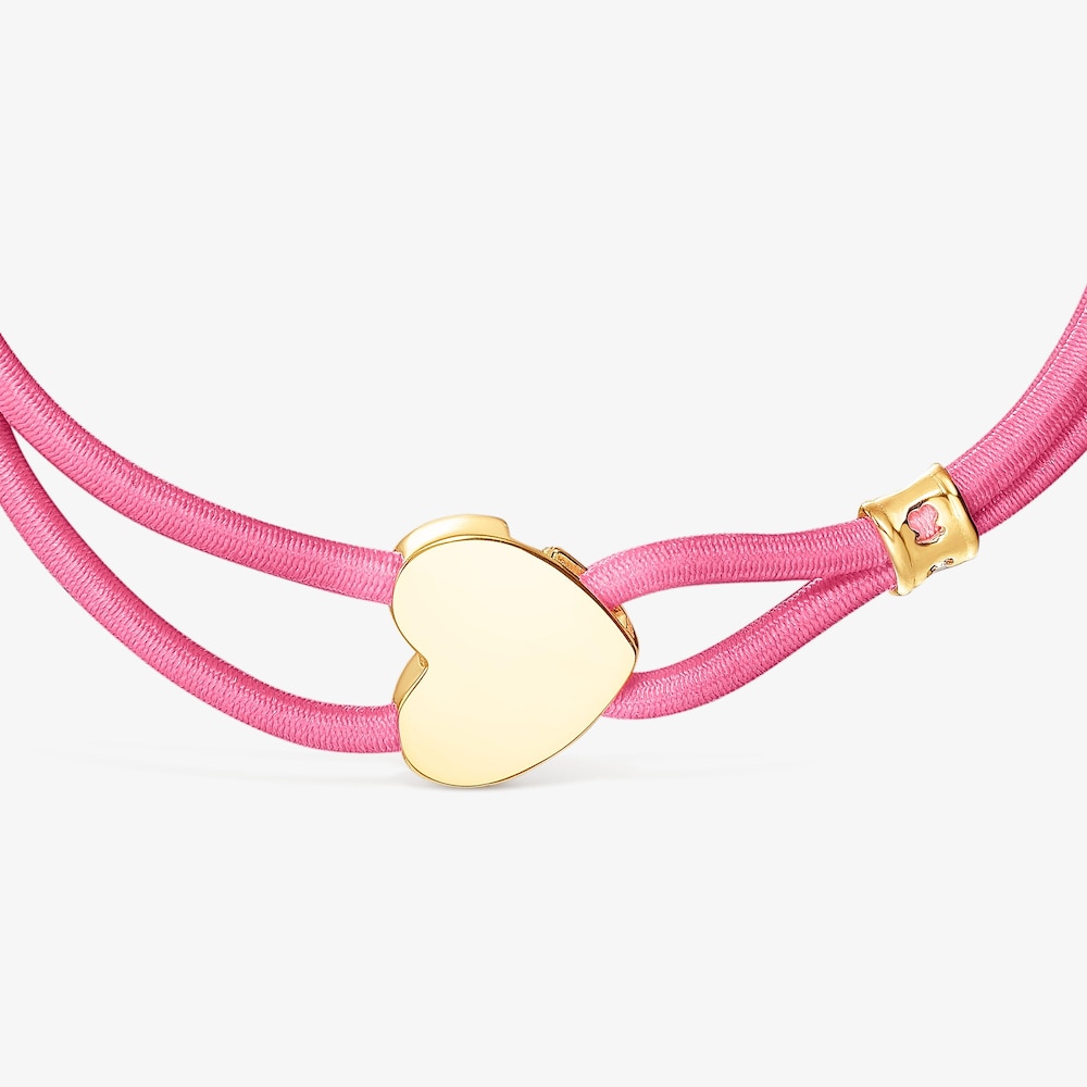 Pulsera el&aacute;stica fucsia y coraz&oacute;n con ba&ntilde;o de oro 18 kt sobre plata Sweet Dolls