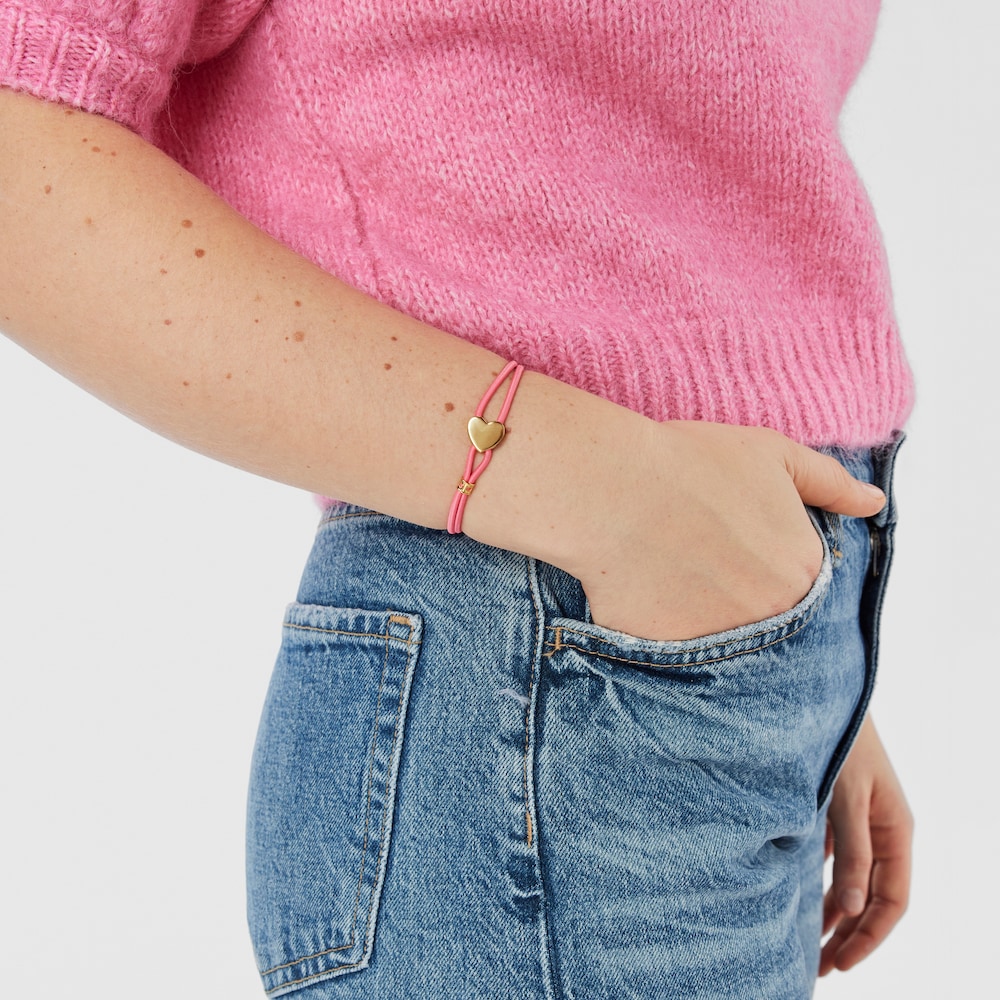 Pulsera el&aacute;stica fucsia y coraz&oacute;n con ba&ntilde;o de oro 18 kt sobre plata Sweet Dolls