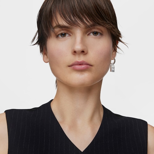 Single silver earring with motif Medallions