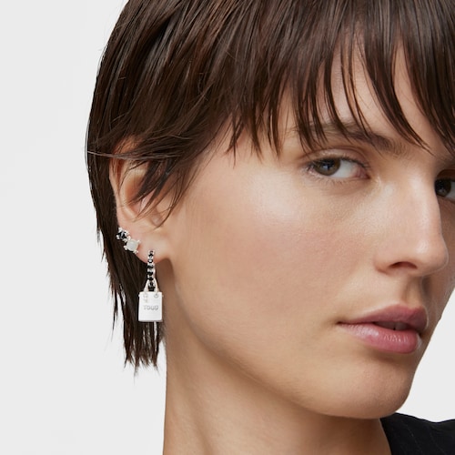 Single silver earring with motif Medallions