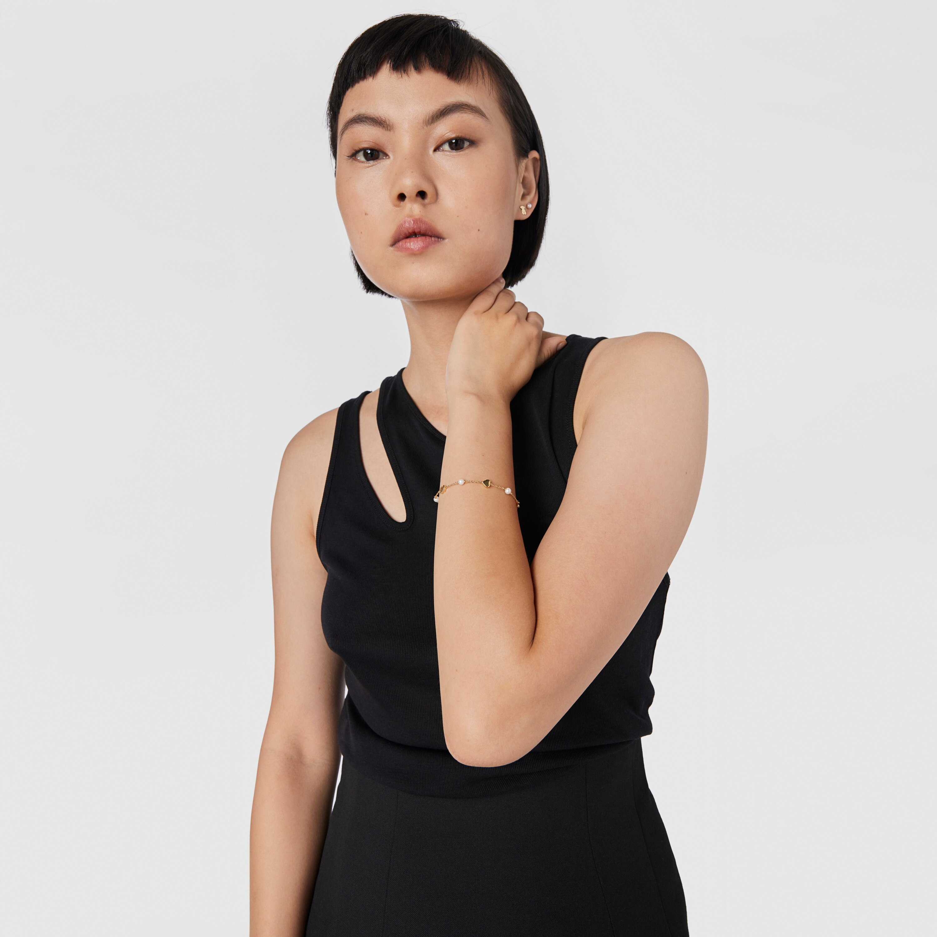 18K solid gold Sweet Dolls XXS Bracelet with pearls and Bear, Star, Heart and Cross motifs..